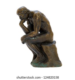 Antique Bronze Figurine Of The Naked Thinker Man. Isolated Image.