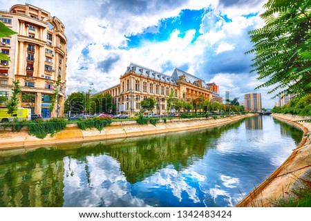 Antique building view in Old Town Bucharest city - capital of Romania and Dambrovita river. Bucharest, Romania, Europe. 