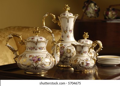 An Antique China Tea Set On A Table