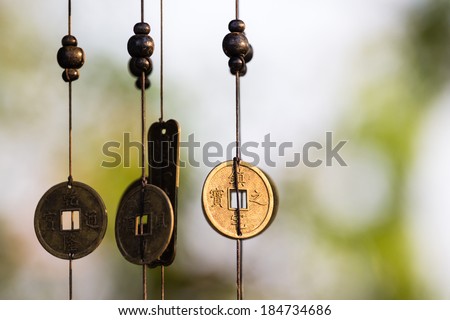 Antique Chinese coins hanged outside the house as wind chimes  for protection and good luck
