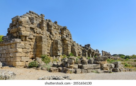 Antique city walls. Ruins of fortress walls and towers of varying degrees of destruction. Side. Turkey. Manavgat. Antalya. Alania. Attractions Side. Fragments of stone walls