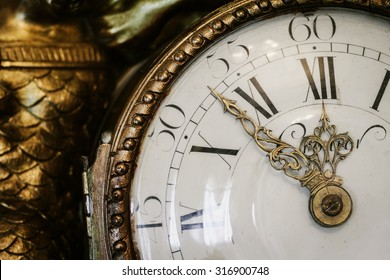 Antique clock with roman numerals in the classical style