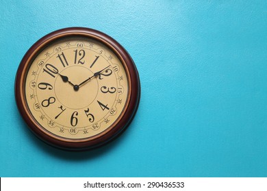 Antique clocks vintage retro styles Hanging on the wall of blue, with space for text. - Powered by Shutterstock