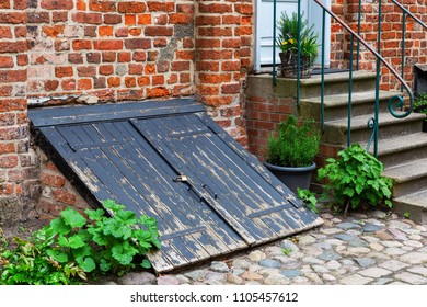 Antique Coal Cellar Door At An Old Brick House In Stralsund, Germany