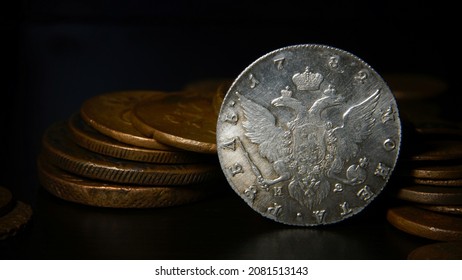 Antique coins of the Russian Empire copper, silver 18-19 century in the dark background