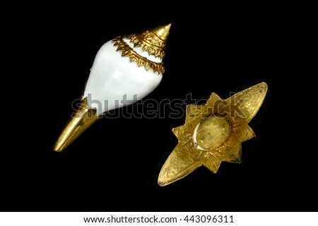 Antique Conch inlaid metal and base , isolated on black background , Top view
