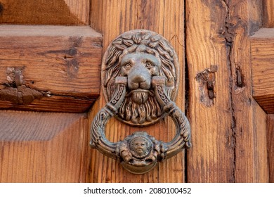 Antique Copper Lion Head Doorknob On A Wooden Door, Tenerife, Canary Islands, Spain