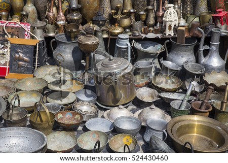 Similar – many part colorful tin buckets at the flea market