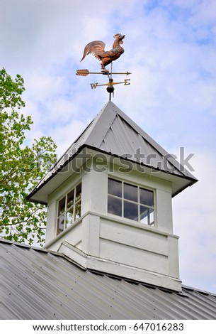 Antique Copper Rooster Weather Vane on top of a Cupola.