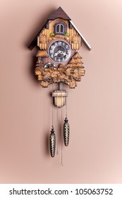 An Antique Cuckoo Clock Hanging On The Wall