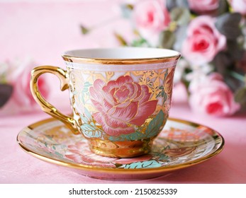 Antique cup of tea with pink rose on pink background ,Valentine's day romantic ,Mother's day ,pretty background or wallpaper ,Chinese traditional ,wedding card design ,coffee cup ,lovely love card 