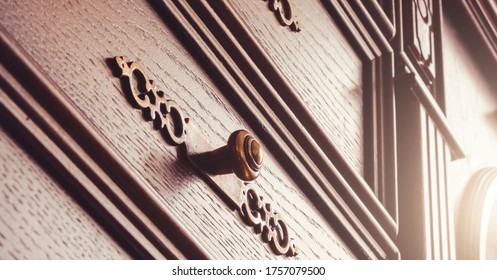 Antique Dark Brown Wooden Chest Of Drawers With Vintage Metal Handles At Sunlight Extreme Close Low Angle Shot