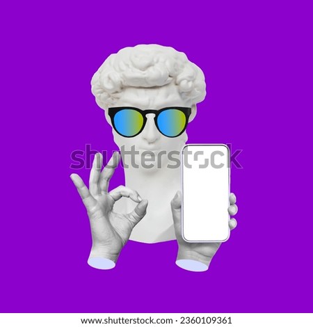 Antique David statue's head in sunglasses holding mobile phone with blank white screen with copy space for text or design showing the ok gesture isolated on purple color background. Contemporary art