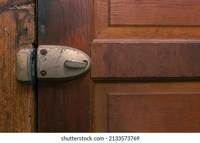 Antique Dead Bolt On A Wooden Door