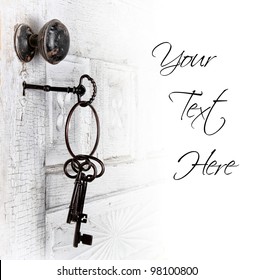 Antique door with keys in the lock isolated area for text