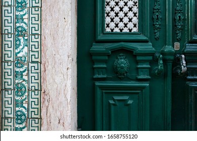Antique door knobs and dandles. Old fashioned door handles and locks. Portuguese azulejo on the wall - Shutterstock ID 1658755120