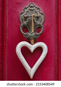 Antique door knocker on antique wooden door. Old Maltese architectural details, Malta. Europe