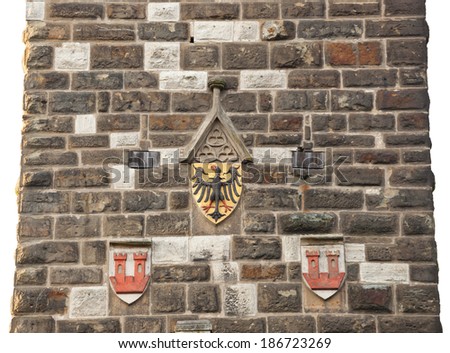 Antique eagles emblem on the wall of old tower in Rothenburg od der Tauber.