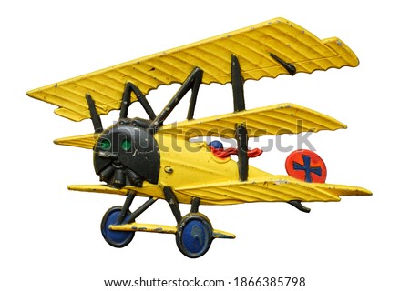 Antique embossed relief decoration, generic Great War (First World War) yellow toy airplane, isolated on white background