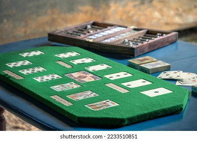 Antique faro game from the 1800's, with cards, banker case and playing table - Shutterstock ID 2233510851