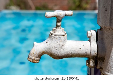 Antique Faucet With Rust And Cracked Paint