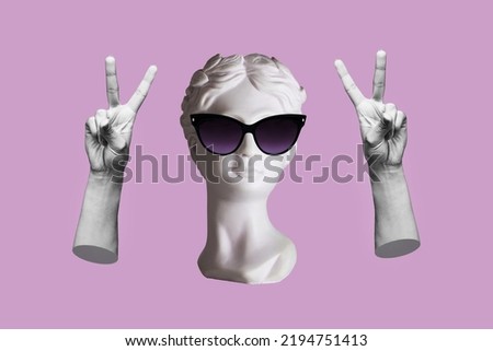 Antique female statue's head in black sunglasses showing a peace gesture with hands isolated on a purple color background. Trendy collage in magazine surreal style. 3d contemporary art. Modern design