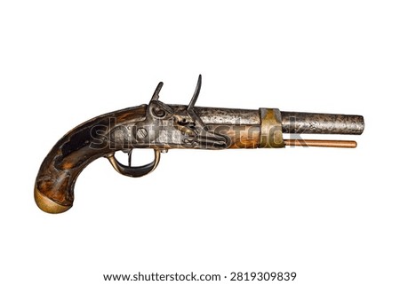 Antique flintlock muzzleloading pistol isolated on a white background.