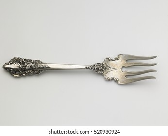 Antique Fork On The White Background