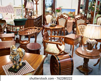Antique furniture store with wooden goods - Shutterstock ID 762280222