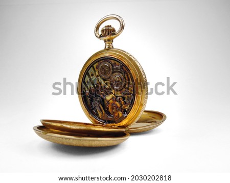 Antique gold pocket watch with water damage and rust on dial face and movement.
