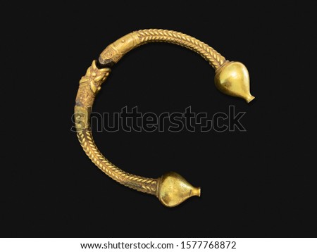 Antique golden bracelet called torc isolated on black background. Rigid neck ring or bracelet from Celts. Circa 1st to 2nd century BC. Galicia, Spain