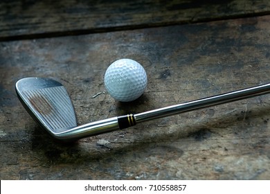 Antique Golf Club And Ball With  Retro Vintage Style.