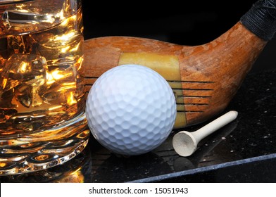 Antique Golf Club With Ball, Tee And Drink On Black Background