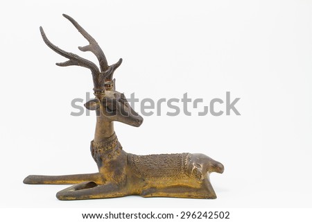Antique grunge brass deer sculpture isolated on white background
