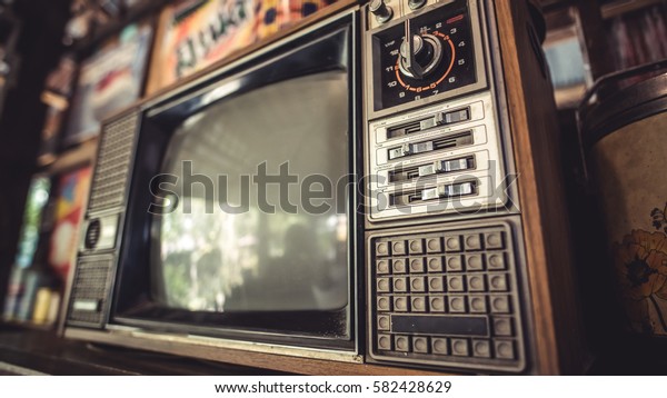 Antique grunge portable black and white television\
screen in vintage\
style.