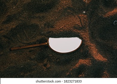 Antique Hand Mirror On The Beach Sand.