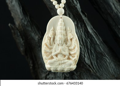 Antique Ivory carved Avalokitesvara isolated on black background