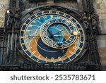 Antique large ancient astronomical clock, historical architecture in the capital of the Czech Republic Prague with a large dial on the wall.