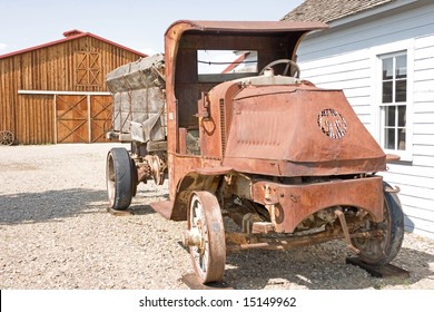 Antique Mack Truck With Wooden Wheels And Crank On Front