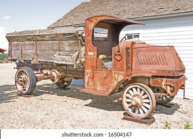 Antique Mack Truck With Wooden Wheels And Crank On Front