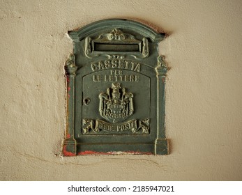 Antique  Mailbox With Rust Marks Built-in The White Wall Of An Old Building.Inscription Says: Mailbox, Royal Postal System.