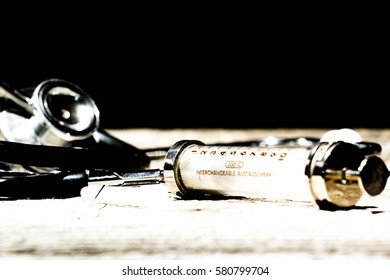 Antique Medical Tools On A Wood Background .