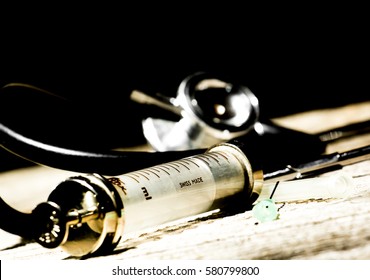 Antique Medical Tools On A Wood Background .