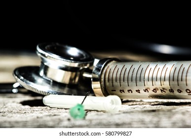 Antique Medical Tools On A Wood Background .