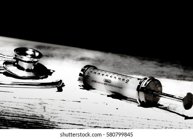 Antique Medical Tools On A Wood Background .