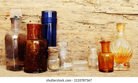 Antique Medicine Bottles, Victorian Era, On A Original 1800s Wooden Background With Space For Your Text Or Design