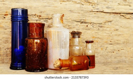 Antique Medicine Bottles, Victorian Era, On A Original 1800s Wooden Background With Space For Your Text Or Design