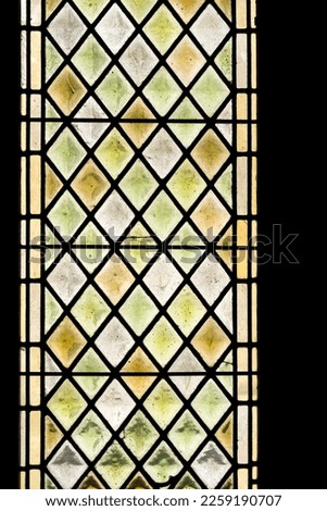 Antique multicolored medieval stained glass window panel in Palace of Popes, Avignon, France