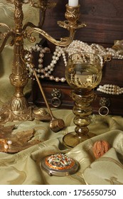 Antique Naturmort With Candelabra, Glass Roemer And Pearl Necklace. Still Life Photography.