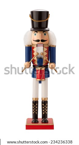 Antique Nutcracker Drummer with a red drum. He has white hair and beard. He sports a black hat, with a blue coat and black boots. The point of view is straight on, and is isolated on white background.